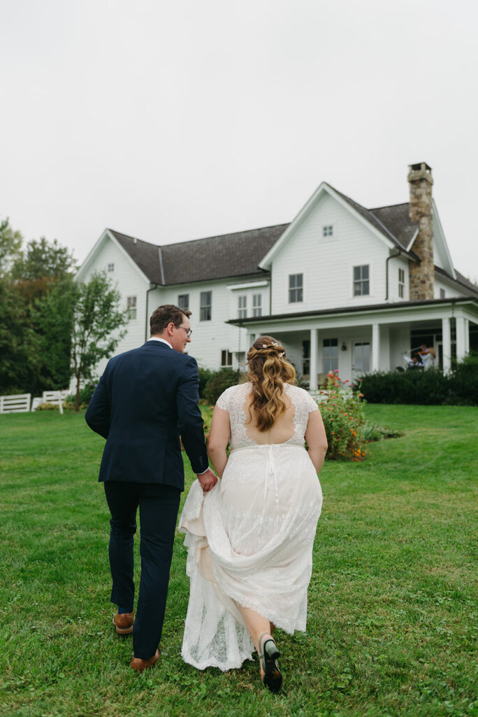 bride and groom heading towards their farm wedding venue - blue hill farm