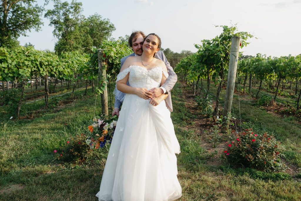 playful wedding couple at a vineyard during their winery wedding day in Virginia