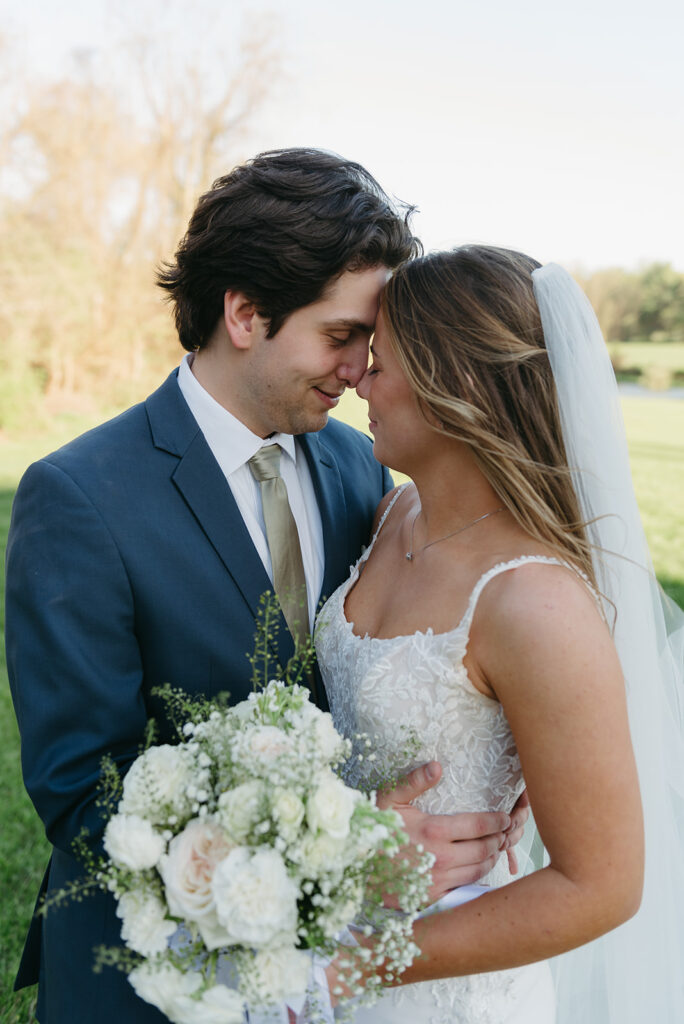 a dreamy bride and groom surrounded by lush green landscapes during their small wedding in loudoun county