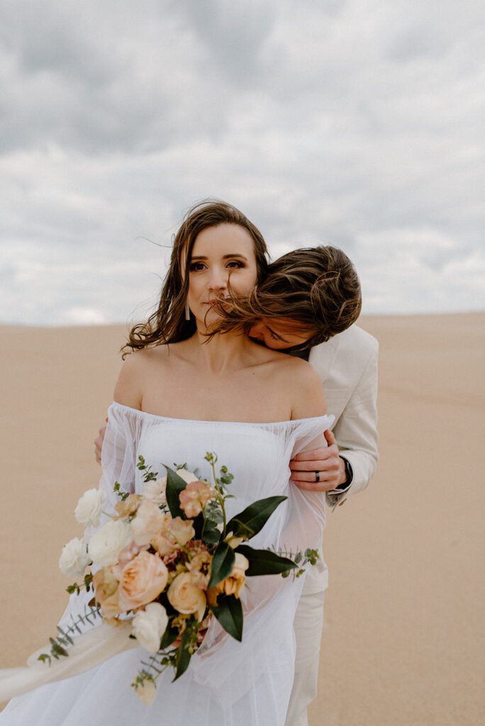 sandy Outer Banks elopement at Jockey’s Ridge State Park, dreamy elopement couple surrounded by sandy fields