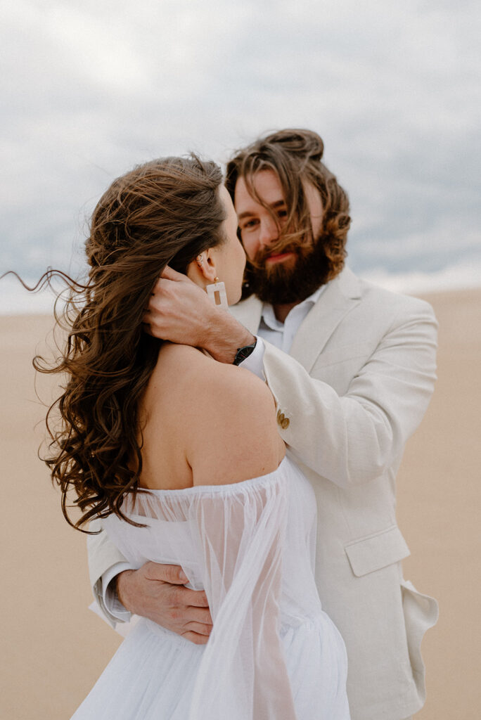 sandy Outer Banks elopement at Jockey’s Ridge State Park, dreamy elopement couple surrounded by sandy fields