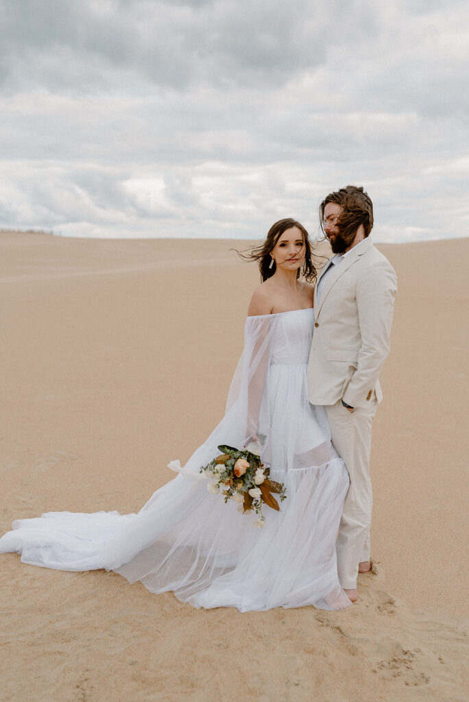 sandy Outer Banks elopement at Jockey’s Ridge State Park, dreamy elopement couple surrounded by sandy fields