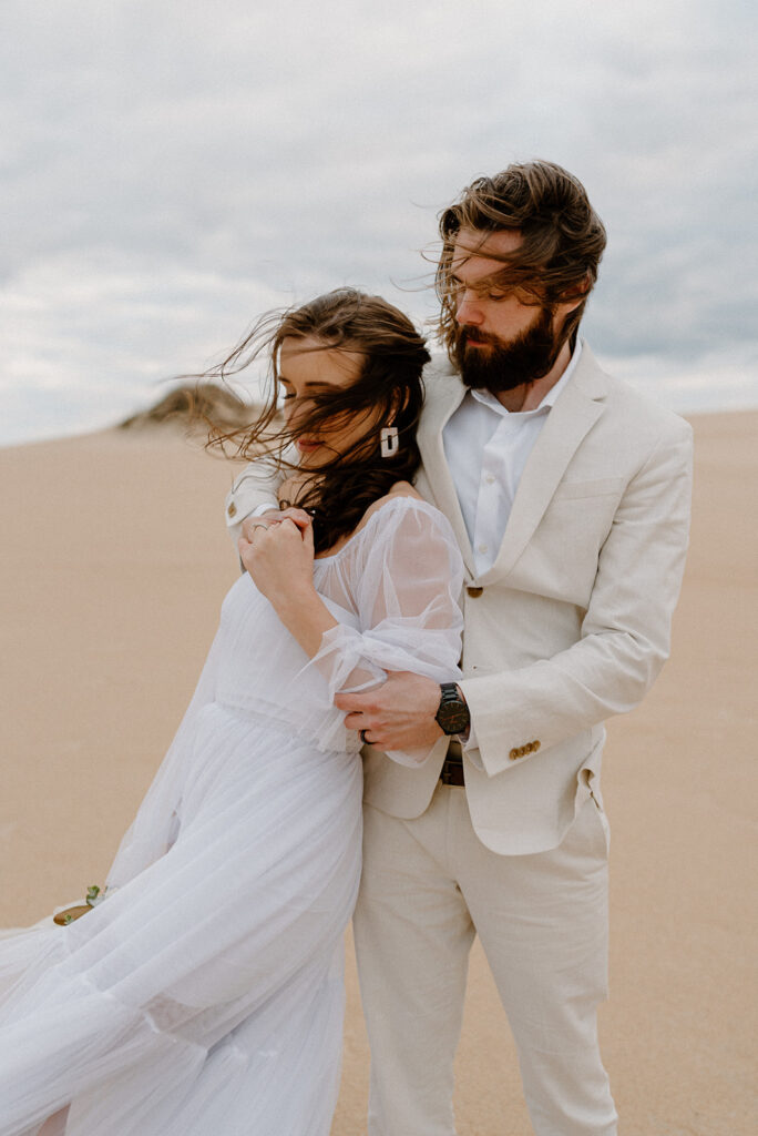 sandy Outer Banks elopement at Jockey’s Ridge State Park, dreamy elopement couple surrounded by sandy fields