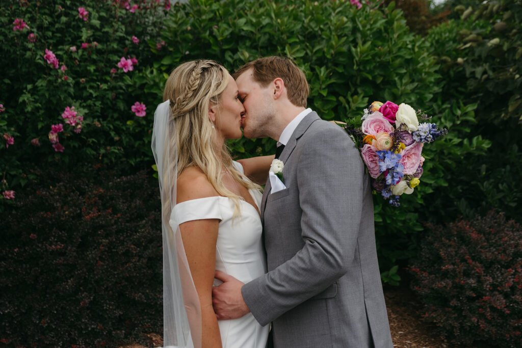 a dreamy bride and groom surrounded by lush green landscapes during their small wedding in loudoun county