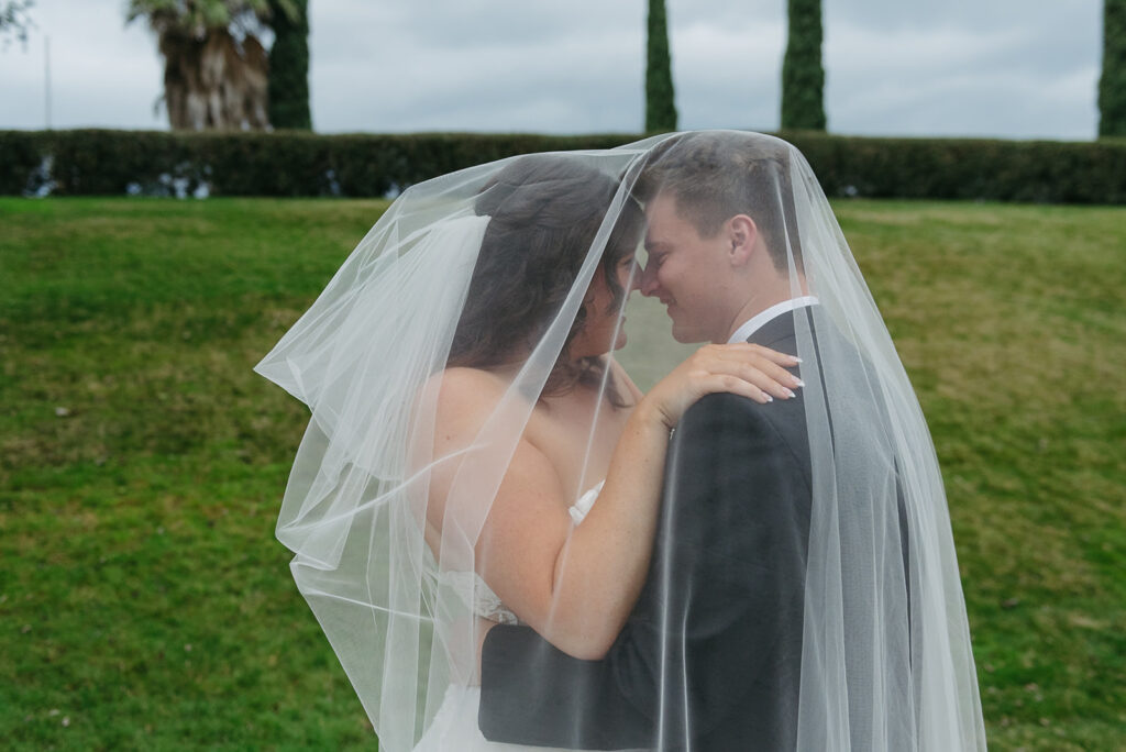 a dreamy bride and groom surrounded by lush green landscapes during their small wedding in loudoun county