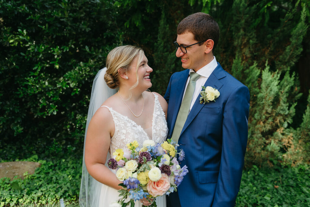 a dreamy bride and groom surrounded by lush green landscapes during their small wedding in loudoun county