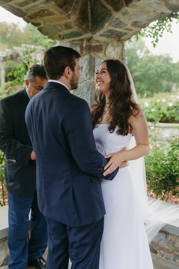 lewis ginter elopement ceremony under a stone gazebo during a bit of rain
